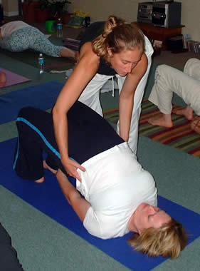 Kate assists Bridge Pose